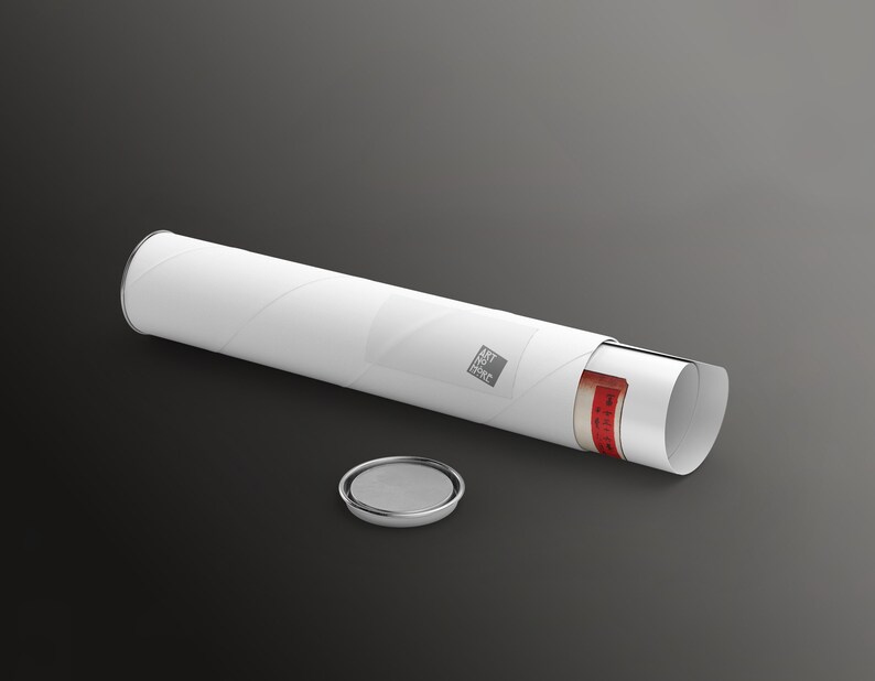May include: White mailing tube with a red and white label that says "Art Print Store" and a rolled up print inside. The tube is open and a silver cap is lying next to it.