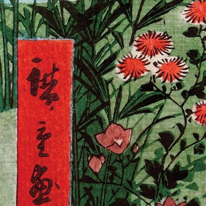 May include: A red and black Japanese woodblock print depicting a garden scene with flowers and a red sign with black calligraphy that reads "The First Month".