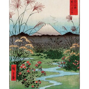 May include: A traditional Japanese woodblock print depicting Mount Fuji in the background with a winding stream in the foreground. The print features a vibrant green landscape with red flowers and tall grasses. The Japanese text in the upper right corner reads "富士三十六景" which translates to "Thirty-Six Views of Mount Fuji".