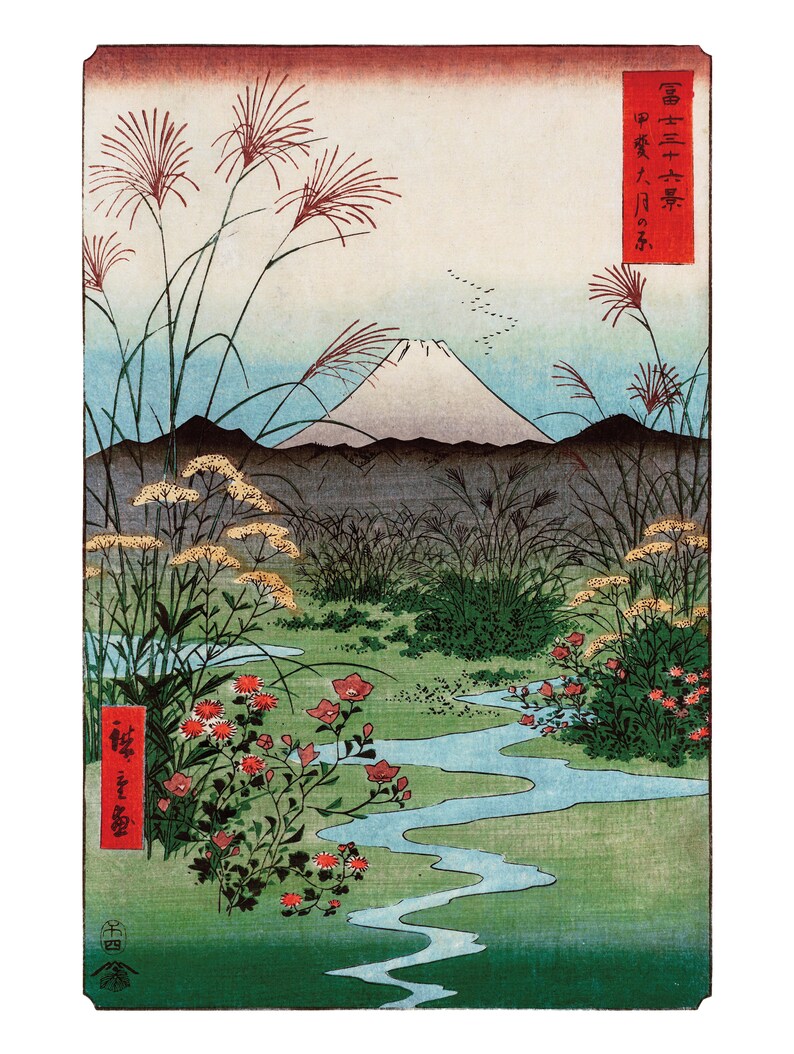 May include: A traditional Japanese woodblock print depicting Mount Fuji in the background with a winding stream in the foreground. The print features a vibrant green landscape with red flowers and tall grasses. The Japanese text in the upper right corner reads "富士三十六景" which translates to "Thirty-Six Views of Mount Fuji".