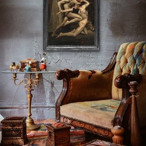 May include: A framed painting depicting a scene from Dante's Inferno. The painting features three figures, two of which are engaged in a struggle. The painting is set against a backdrop of a fiery landscape.