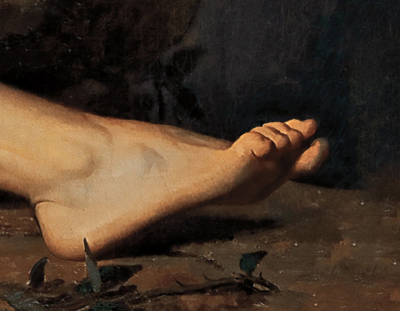 May include: A close-up of a bare foot resting on a dark brown surface. The foot is slightly bent at the ankle and the toes are curled.