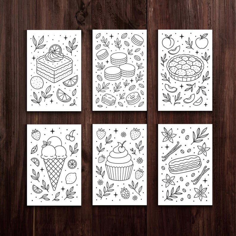 May include: Six black and white dessert illustrations on white cards. The illustrations include a cake with a lemon slice, macarons, a pie, ice cream in a cone, a cupcake, and an &eacute;clair. Each card has a decorative border of leaves and other elements.