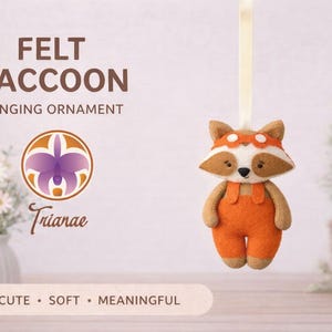 May include: A felt raccoon hanging ornament. The raccoon has a white face, brown and tan accents, and wears orange overalls. The text on the image reads "FELT RACCOON HANGING ORNAMENT" and "Cute, Soft, Meaningful."