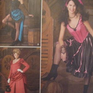 May include: Three women wearing different vintage-style dresses. The woman on the left is wearing a black and blue dress with a bustle. The woman in the middle is wearing a red dress with a bustle. The woman on the right is wearing a pink and black dress with a bustle.