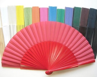 May include: A set of 16 hand fans in various colors, including white, beige, yellow, green, orange, pink, blue, purple, brown, and black. The fans are made of paper and have wooden handles.