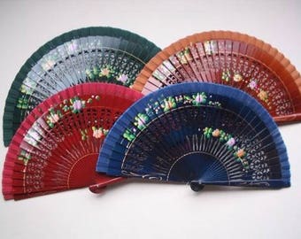 May include: Four hand fans with intricate floral designs. The fans are made of wood and have a variety of colors, including red, blue, green, and brown.