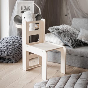 Matching cube chair designed for toddler ergonomics.