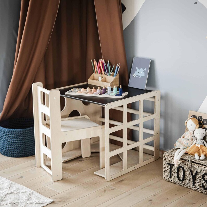 Close-up view of an organized kids study station featuring a convertible desk and chair.