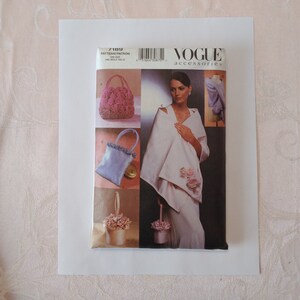 May include: Vogue Accessories pattern number 7189, one size, one skills table. The pattern includes instructions for making four different accessories: a pink ruffled handbag, a light blue satin bag with a ruffled trim, a white basket with pink flowers, and a white basket with pink flowers and a white handle.