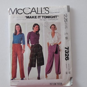 May include: Vintage McCall's sewing pattern featuring three women modeling different styles of pants. The pattern includes the text "MAKE IT TONIGHT" and "WEAR IT TOMORROW!" The pattern number is 7326, with a waist size of 28 inches.