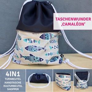 Pode incluir: Mochila com cordão azul marinho e bege com padrão de peixes azuis e turquesas. Fecho de correr e cordões brancos. O texto "TASCHENWUNDER, CAMALÉON" é visível. Pode ser usada como saco de ginásio, mala de mão ou shopper.