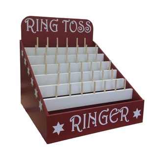 以下が含まれることがあります： 赤い木製のリングトスゲーム。白い星と「Ring Toss」と「Ringer」の文字が前面に書かれています。