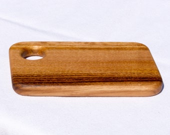 Small serving or breakfast board made of sweet chestnut with egg holder
