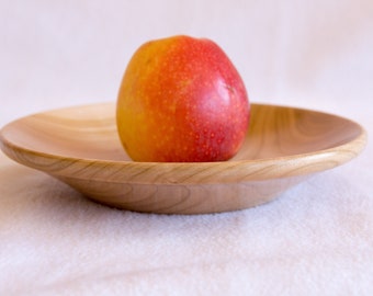 Medium-sized twisted plate made from the wood of a wild cherry