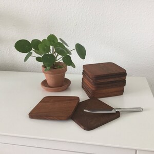 Teakwood : A set of 12 danish midcentury teakwood small boards- massive teakwood in deep brown color. Real Scandinavian retro style / a perf