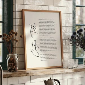 a framed print of a song lyrics, with a wooden frame and a black background.