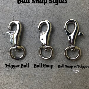 May include: Three silver bull snap styles: trigger bull snap, bull snap, and bull snap with trigger.  Bull Snap Styles.