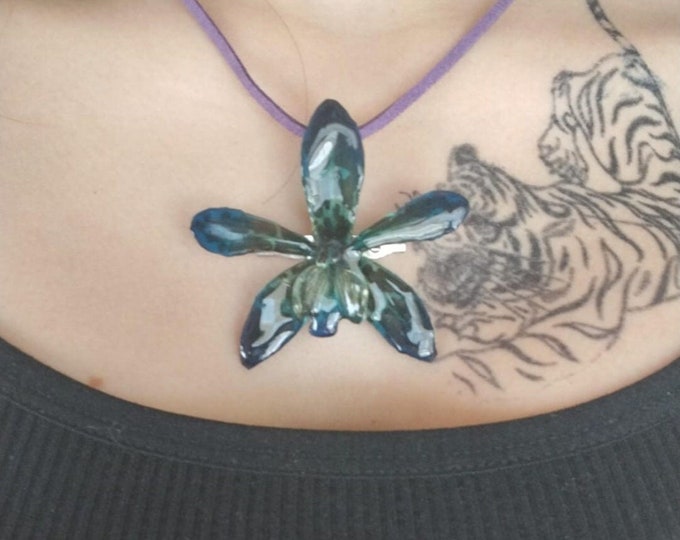 Tiger orchid flower brooch pendant necklace embedded in resin with leather strap.