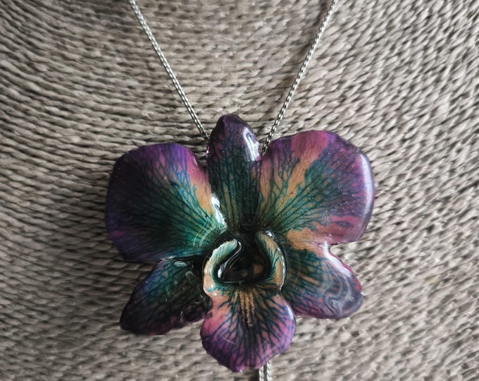 Necklace with real purple dendrobium orchid and multicolored reflections