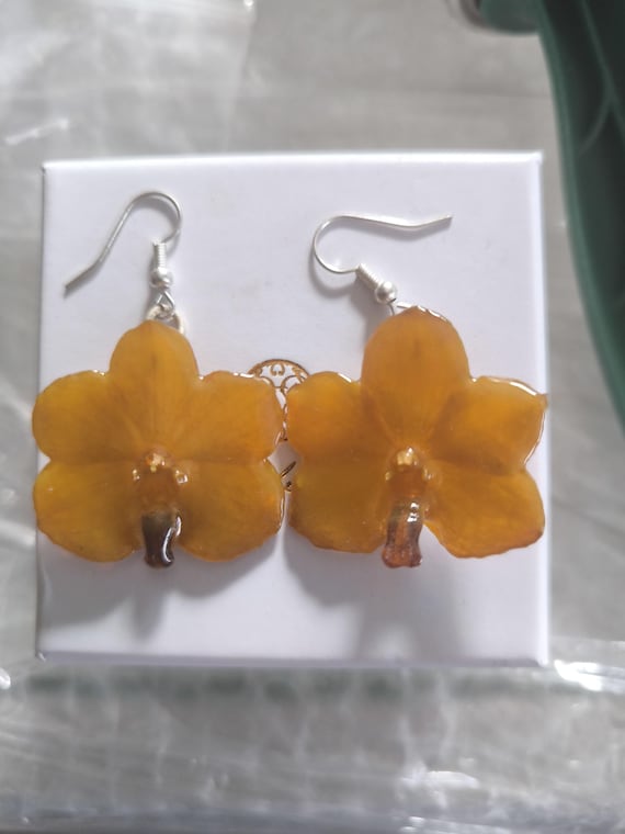 Mini orchid pendant earrings embedded in resin with silver hooks
