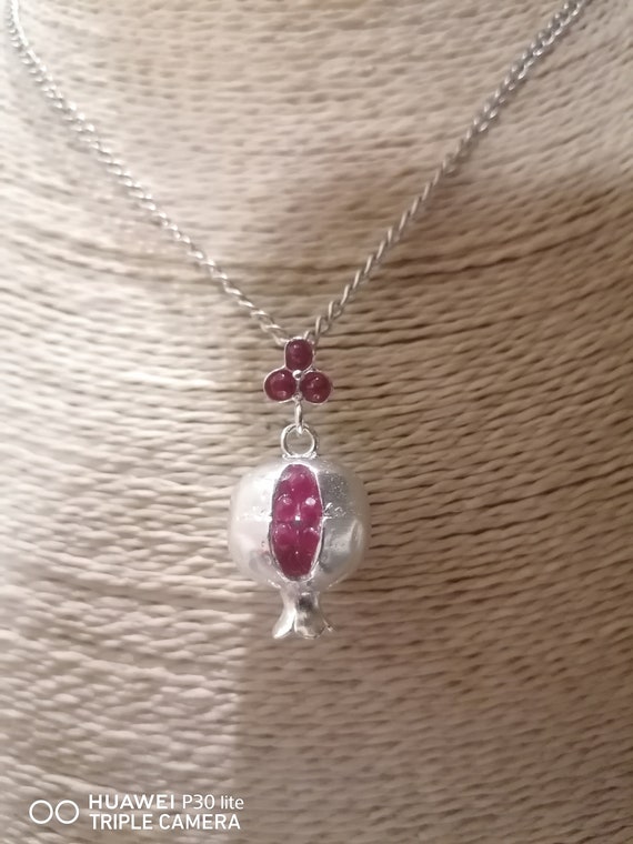 Pomegranate pendant in silver galvanized on bronze and finished with natural red garnets