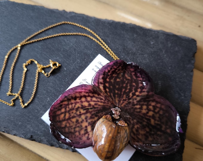 Purple PAPHIOPEDILUM orchid necklace embedded in resin and finished with a gold on bronze chain.
