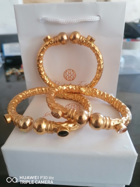 Trio of Etruscan bracelets on offer