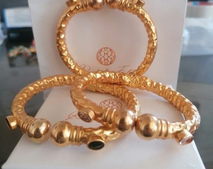 Trio of Etruscan bracelets on offer