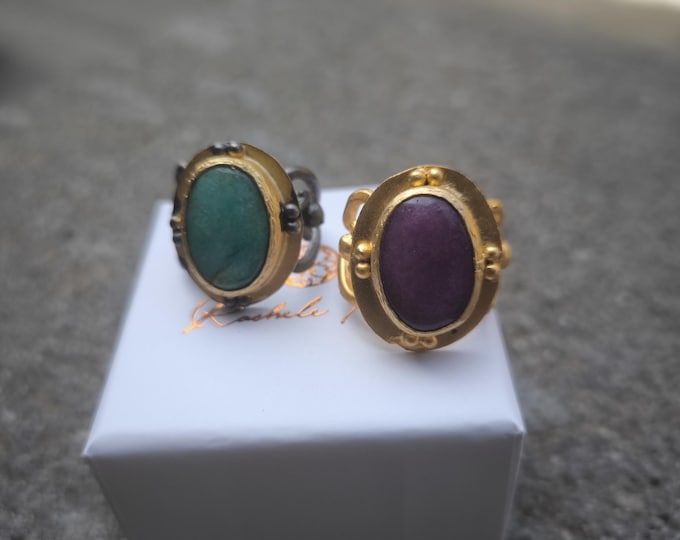 antique style rings in gold on bronze and silver embroidery