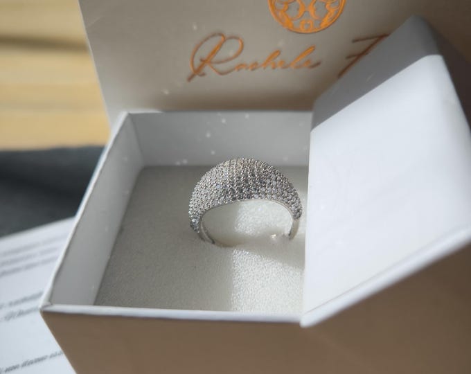 Silver ring with natural white topazes