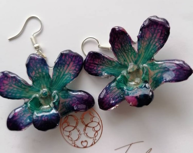 Real orchid earrings embedded in resin