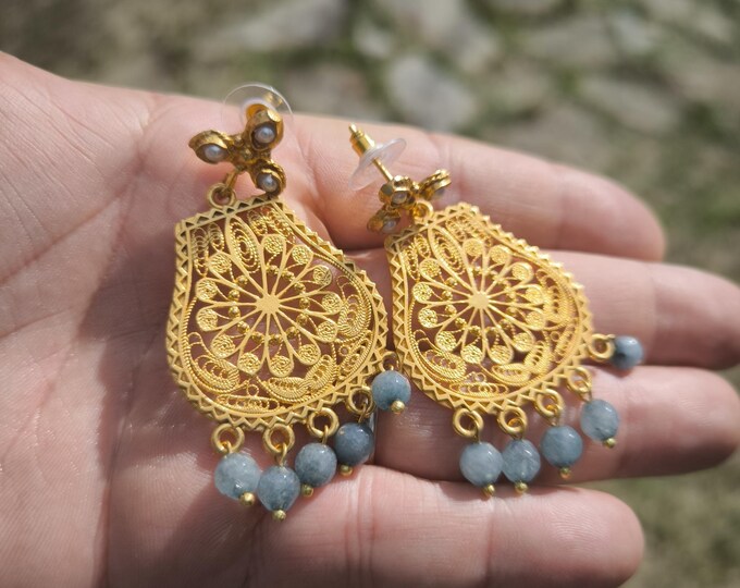 gold filigree earrings with natural dark blue topazes.