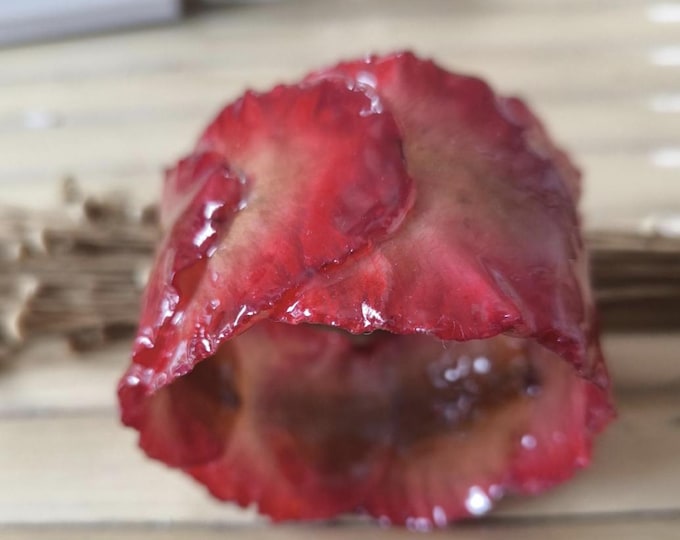 bracelet with real lobster red orchid petals embedded in resin.