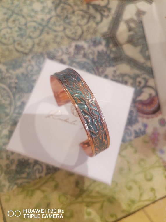 Adjustable bracelets in copper and enamels from goldsmiths