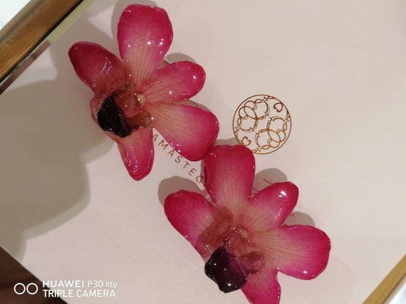 Pair of natural orchid earrings incorporated in resin with silver hooks