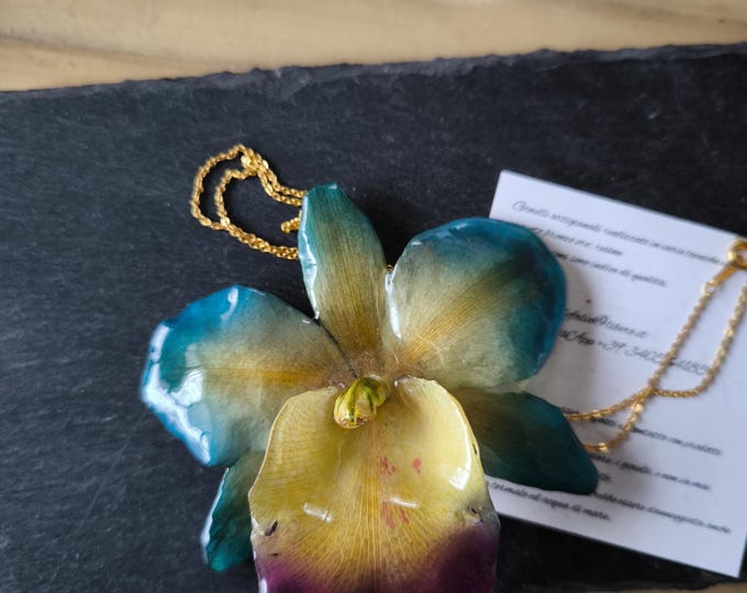 Sakura orchid necklace embedded in resin finished with gold chain on bronze with galvanic technique