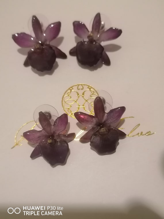 Mini Cattlaya orchid earrings incorporated in resin