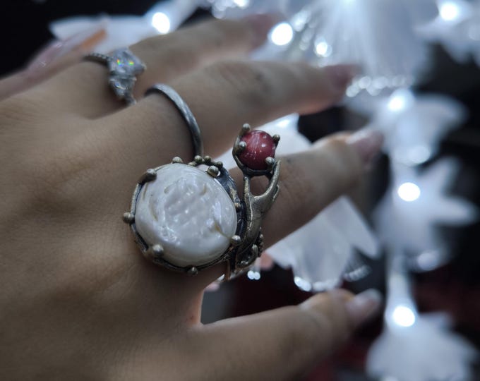 Hand sculpture ring in silver with baroque pearl and red bamboo coral