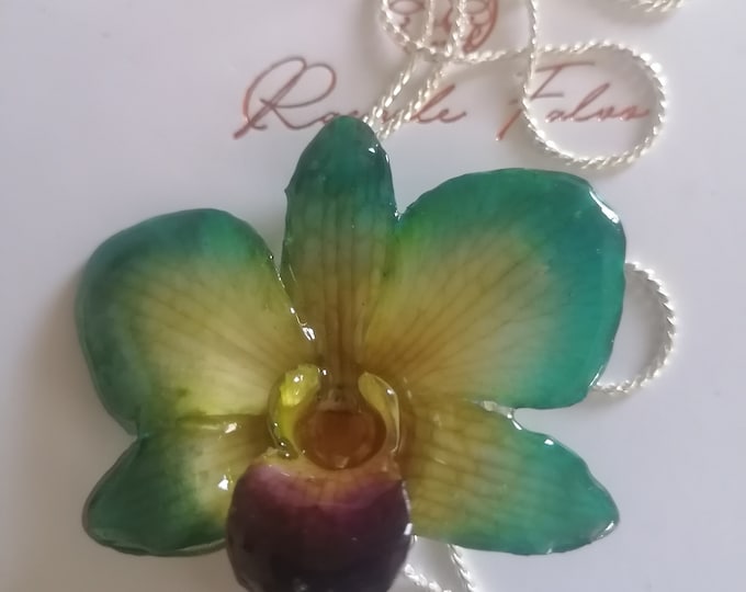 Green/yellow orchid necklace with purple mouth embedded in resin and finished with adjustable galvanized silver slider