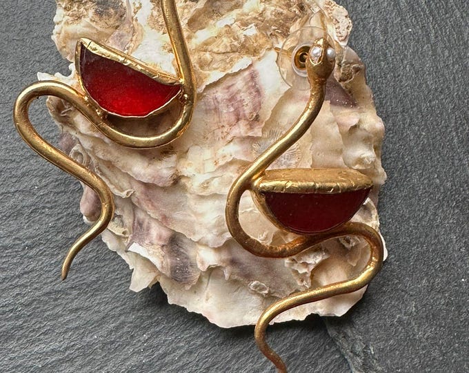 Spectacular snake earrings with pearls and faceted natural stones.