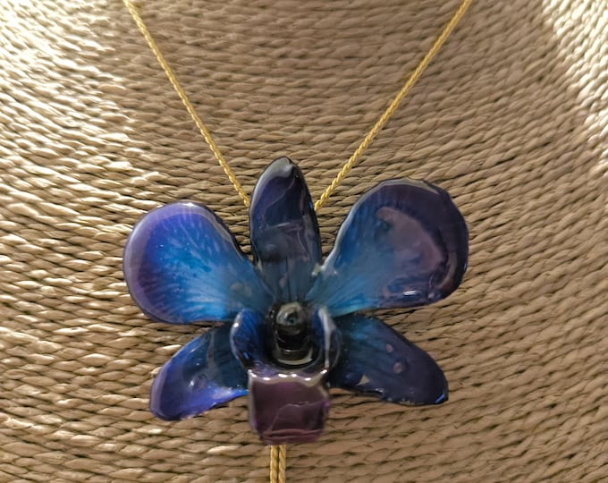 Dark/Blue phalenopsis orchid necklace embedded in resin and finished with gold-plated sliders