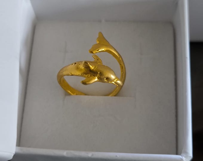 adjustable gold on bronze intertwined dolphin ring.
