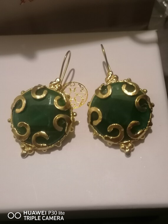 Earrings in matte gold over bronze and finished with raw green jades