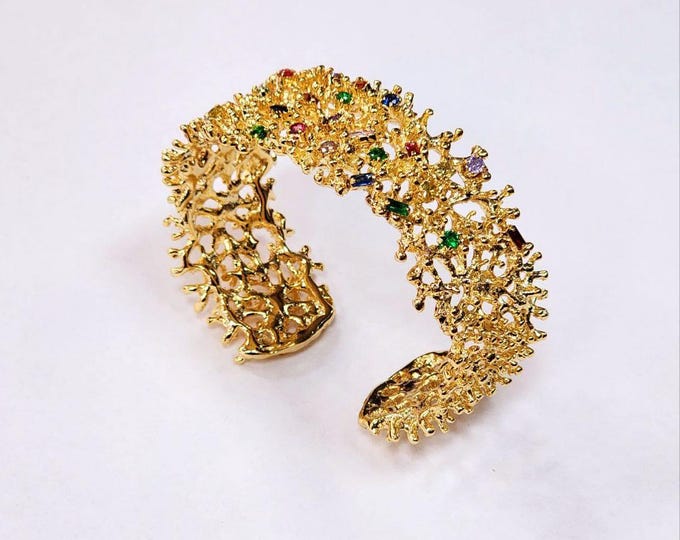 Gold coral bracelet with multicolored natural quartzites and topazes