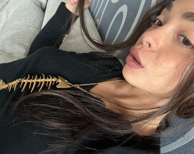 Fish pendant complete with gold chain on bronze and turquoise