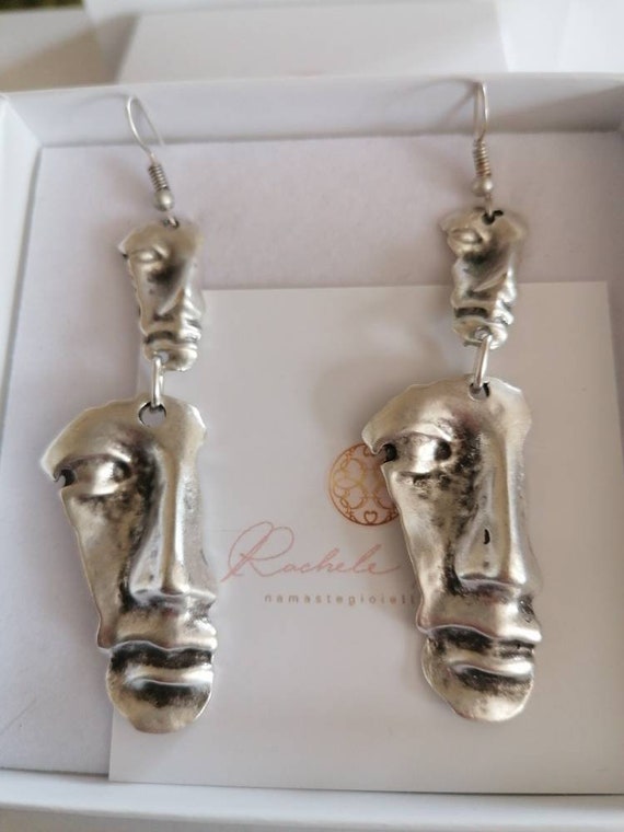 Spectacular pair of face earrings in rhodium-plated silver