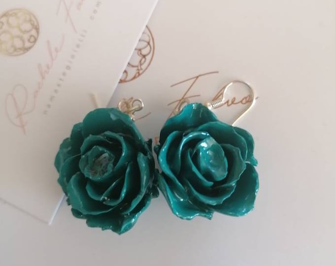 Earrings made with real roses embedded in resin.