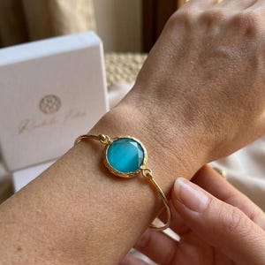 Matte Gold Rigid Bracelet with Blue Cat's Eye, Thin Bangle with Hook Closure and Natural Stone, Rachele Falvo Jewelry