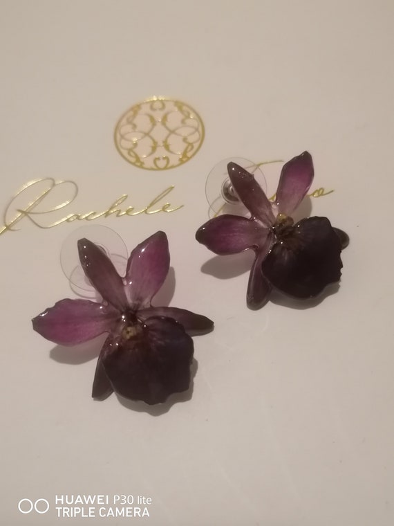 Mini Cattlaya orchid earrings incorporated in resin